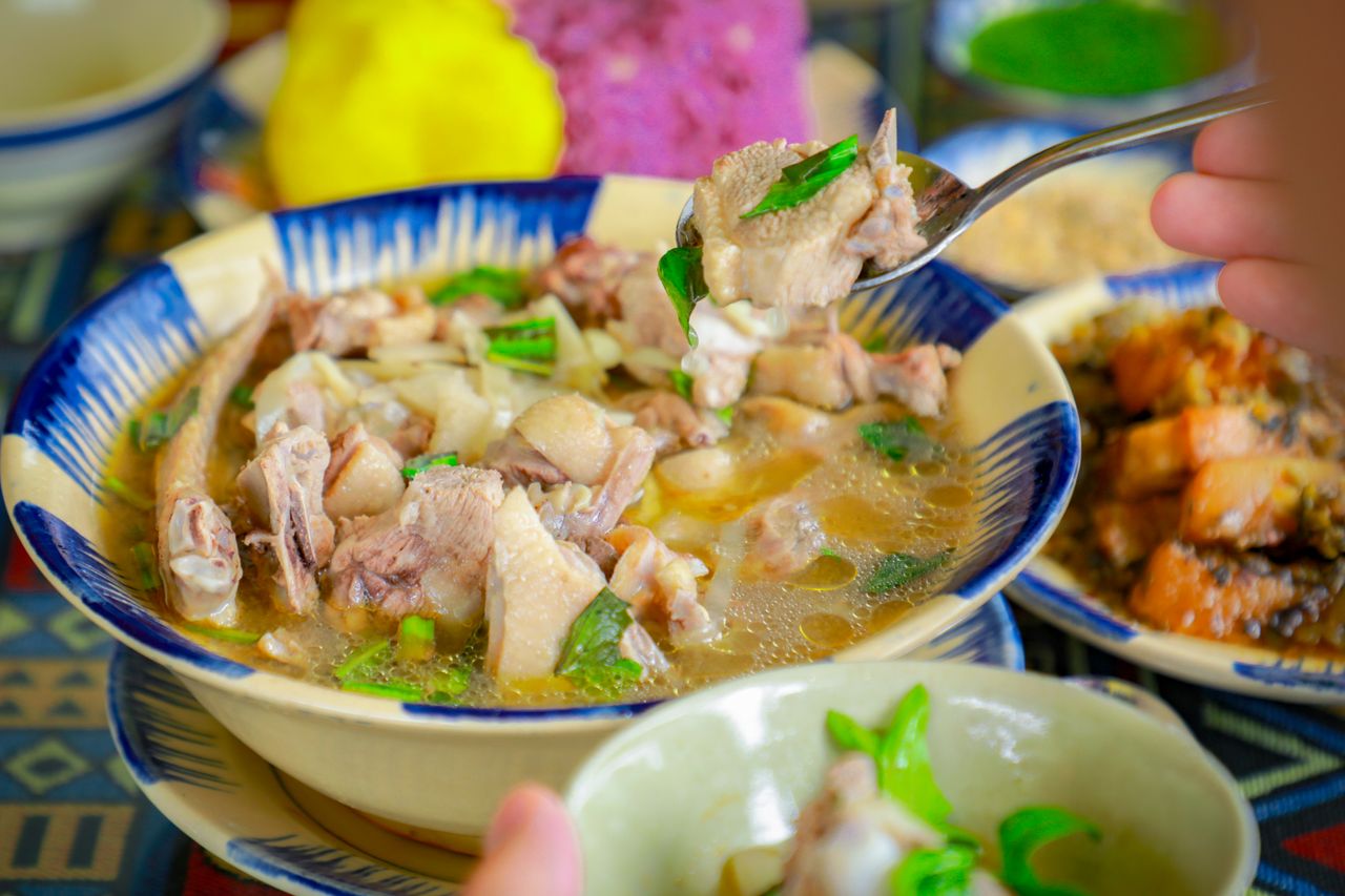 Delicious Vietnamese duck soup with bamboo shoots at a restaurant setting.